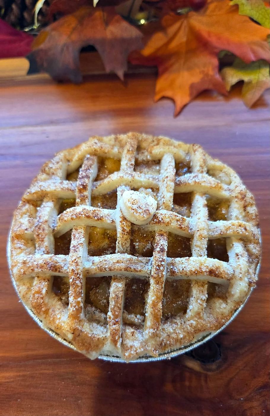 A lattice-top pie dusted with sugar